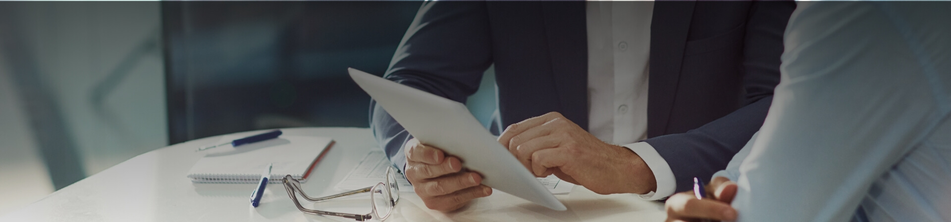 Men Guide Someone With Holding A Tablet